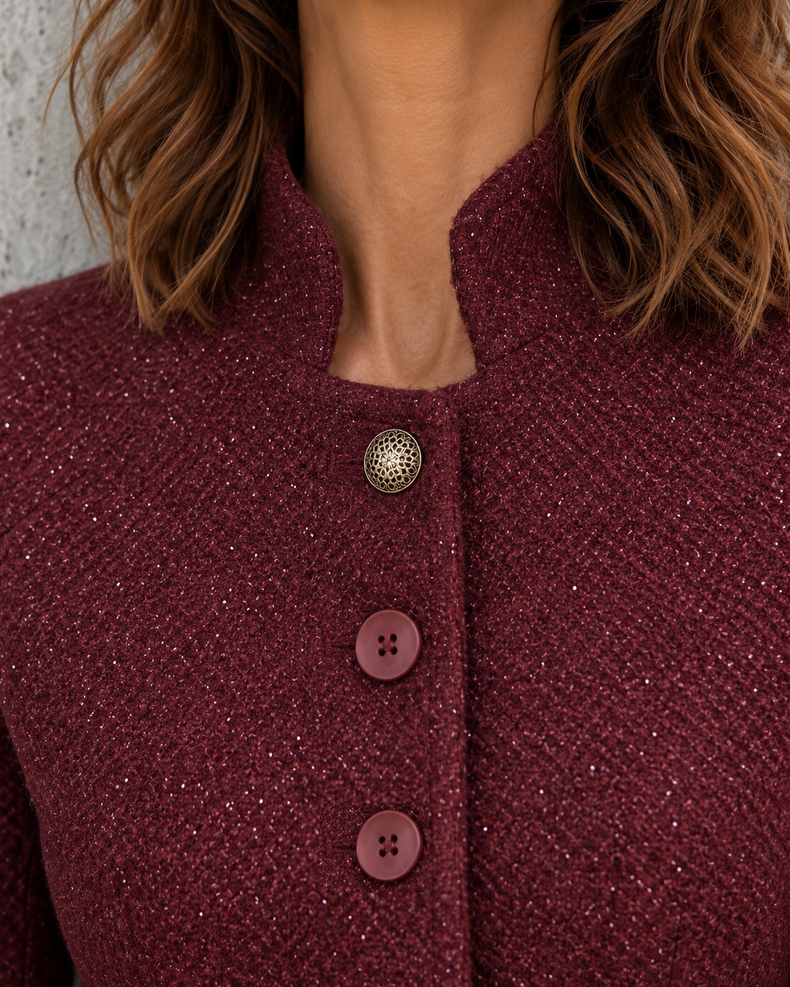 Close-up of the deep port jacket with decorative gold button